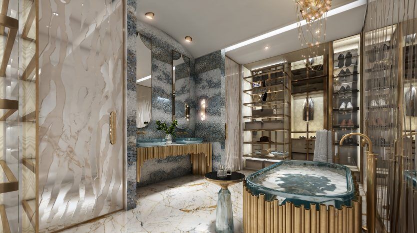 Salle de bains luxueuse dans un appartement de Dubaï avec un sol en marbre, un jacuzzi aux finitions dorées et d'élégantes étagères à chaussures. Des lustres délicats et des murs à motifs bleus ajoutent de la sophistication.