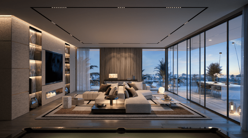 Salon moderne et luxueux au crépuscule avec canapé sectionnel, table de billard, grandes fenêtres donnant sur les toits de la ville de Dubaï et éclairage ambiant chaleureux.