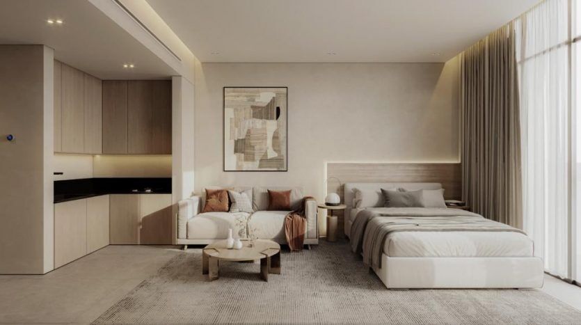 Studio moderne avec un coin salon et chambre intégré, doté d'une palette de couleurs neutres, d'un mobilier minimaliste et d'un éclairage naturel, parfait pour vivre comme une villa à Dubaï.