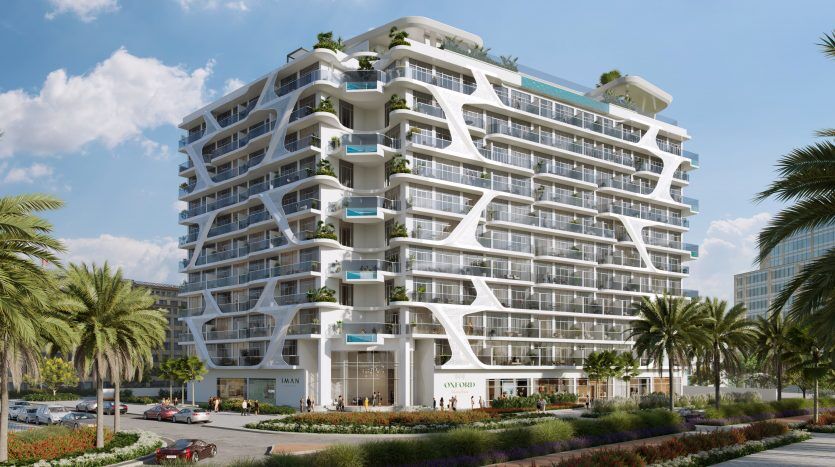 Rendu architectural d'un bâtiment moderne de plusieurs étages présentant une façade blanche avec des balcons ondulants et une verdure luxuriante, conçu comme un investissement à Dubaï. Des palmiers bordent la façade, et là