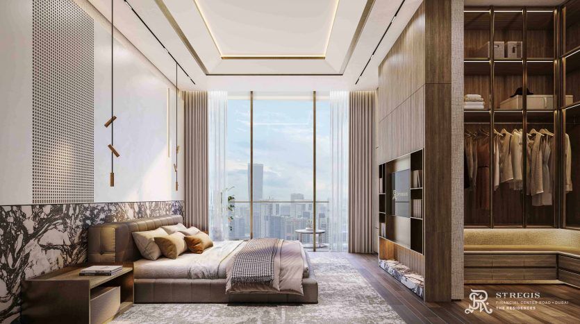 Chambre luxueuse dans un appartement de Dubaï avec un canapé beige, un grand lit et de vastes étagères en bois, donnant sur un paysage urbain à travers des baies vitrées. Accents de marbre élégants et éléments de design modernes