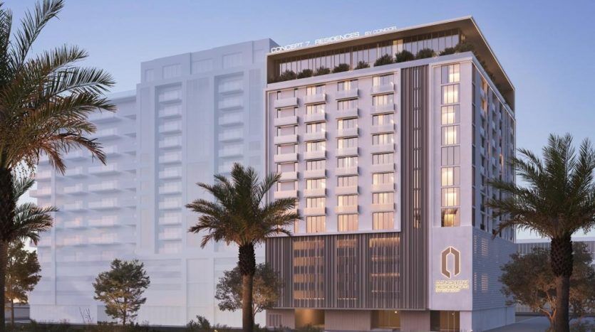 Rendu 3D d'un hôtel moderne au crépuscule à Dubaï, avec des extérieurs éclairés, un logo bien visible sur la façade, des palmiers et une entrée paysagée.