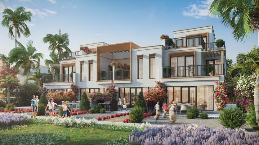 Une maison moderne et spacieuse avec des murs blancs et des balcons élégants à Dubaï, entourée de jardins luxuriants et de groupes de personnes profitant d'une journée ensoleillée.