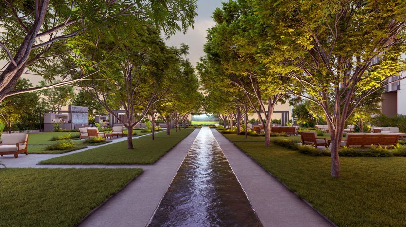 Un parc extérieur serein avec un plan d'eau étroit centré entre des allées symétriques, encadré d'arbres luxuriants et de bancs sous un éclairage chaleureux au crépuscule, ressemblant aux décors tranquilles que l'on trouve souvent à proximité des villas de luxe à Dubaï.