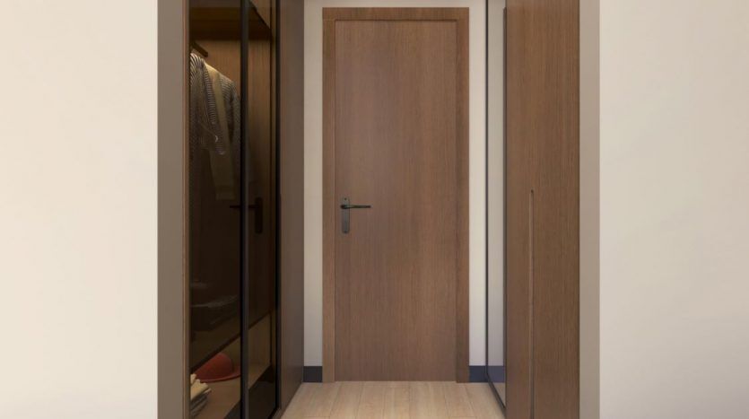 Couloir minimaliste moderne dans une villa à Dubaï, avec parquet et murs en bois, porte fermée en bois, placard intégré avec portes en miroir et deux plafonniers.