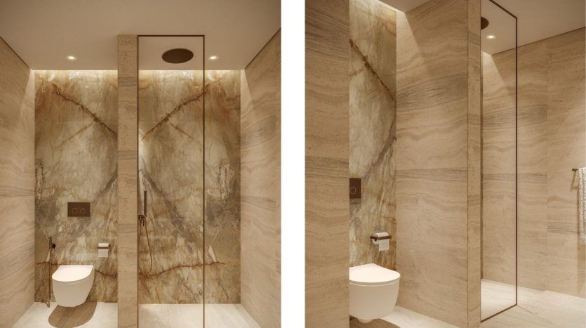 Une salle de bains moderne dans une villa à Dubaï avec des murs et un sol en marbre, des toilettes murales et un espace douche élégant mis en valeur par un éclairage subtil.