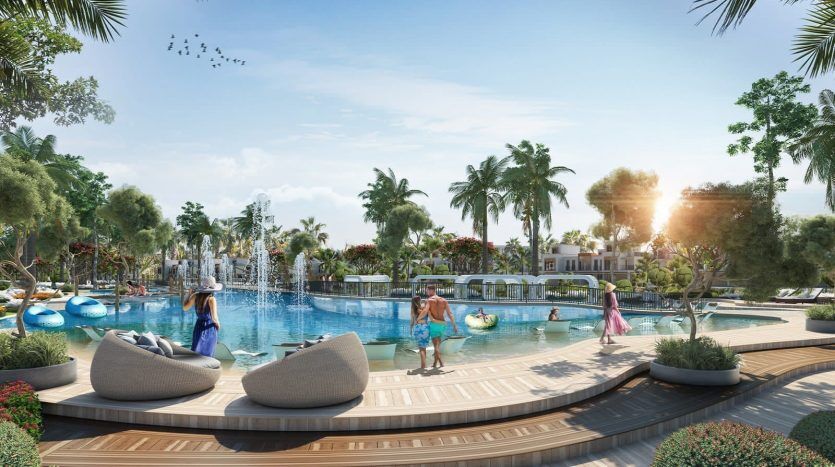Una animada escena en la piscina con tumbonas, exuberante vegetación y gente disfrutando de un día soleado. La decoración presenta plantas tropicales y arquitectura moderna bajo un cielo despejado de Dubai.