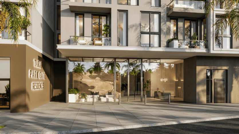 Immeuble d'appartements de luxe moderne avec portes vitrées, entouré de palmiers, arborant une pancarte "Villa Dubai Residence". La lumière du soleil projette des ombres sur la façade.