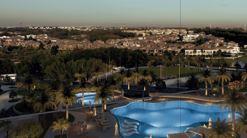 Vue aérienne d'un quartier résidentiel luxueux au crépuscule, doté d'une grande piscine et de jardins bien entretenus, avec un vaste paysage urbain en arrière-plan. Idéal pour ceux qui cherchent à investir à Dubaï