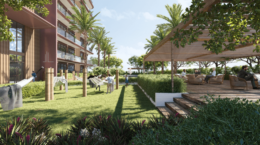 Terrasse extérieure luxuriante avec des gens se relaxant sur un mobilier moderne, entouré de plantes vertes et de détails en bois élégants, à proximité d'un immeuble d'appartements contemporain à Dubaï.