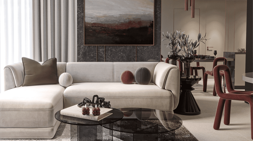Salon moderne dans une villa de Dubaï avec un canapé sectionnel beige, une table basse en verre avec des livres, une peinture abstraite au-dessus du canapé et un coin repas en arrière-plan.