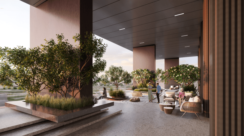 Coin salon extérieur moderne au crépuscule avec des sièges élégants, des plantes en pot, des accents en bois et des allées en pierre lisse, le tout sous une structure contemporaine avec un éclairage ambiant, idéal pour un investissement immobilier à Dubaï.