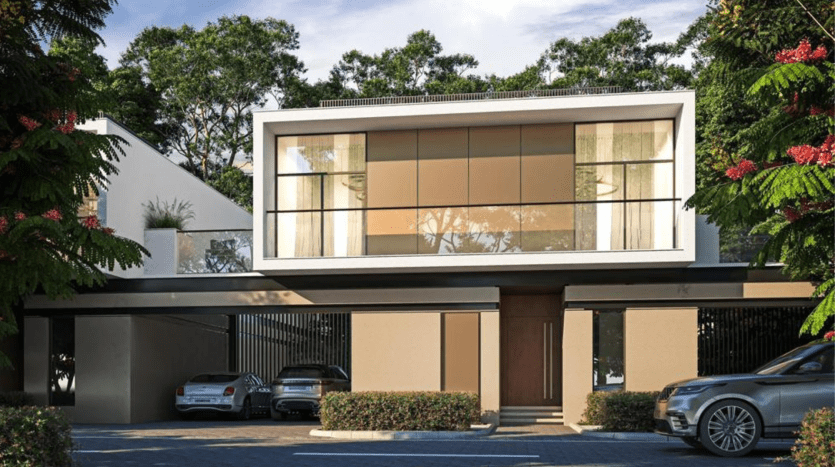 Villa moderne de deux étages à Dubaï avec de grandes fenêtres en verre, un toit plat et des voitures garées dans l'allée, entourée d'une verdure luxuriante et d'arbres en fleurs.