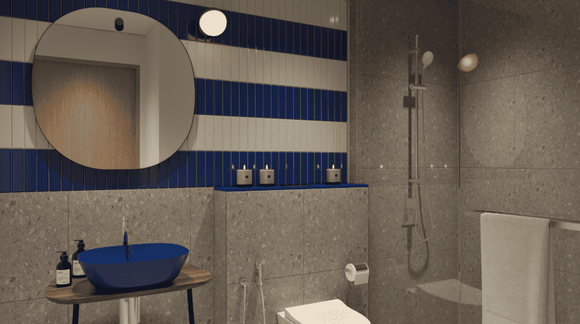 Une salle de bains moderne avec des murs à rayures bleues et blanches, un miroir mural rond, une vasque bleue sur un support en bois, une baignoire blanche et un espace douche ouvert dans une propriété de premier immobilier à Dubaï