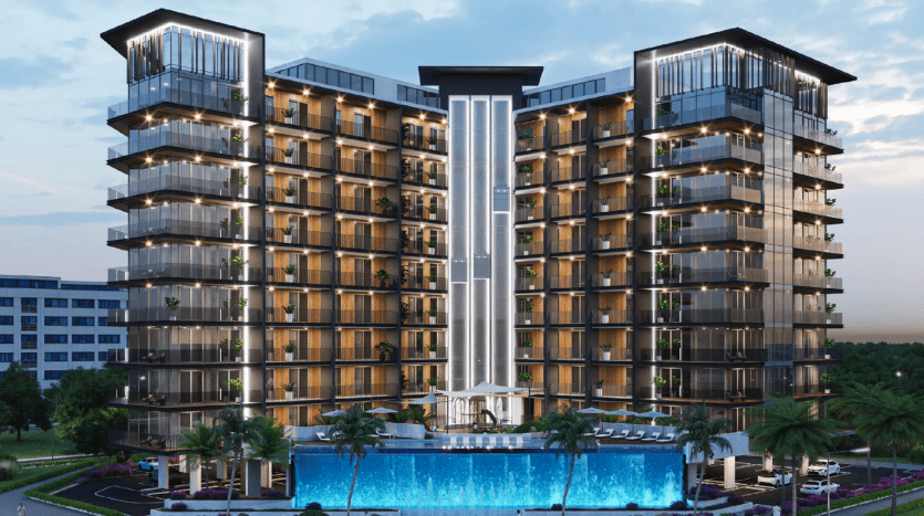 Villa résidentielle moderne de grande hauteur à Dubaï avec façade éclairée en bleu, piscine et environnement verdoyant au crépuscule.