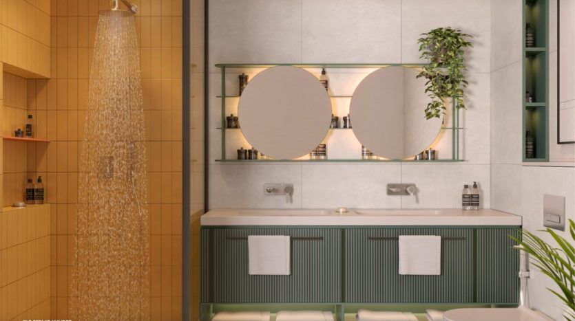 Une salle de bains moderne dans une villa de Dubaï comprend une douche en verre, un meuble-lavabo vert à double vasque avec des miroirs ronds, des murs blancs, des plantes suspendues et un code QR dans le coin pour plus d'informations.
