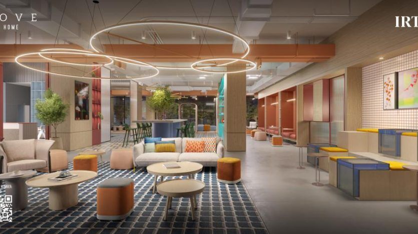 Une image d'un salon de bureau moderne et dynamique comprenant des sièges assortis, des meubles colorés, des tapis géométriques et des plantes décoratives dans une propriété d'investissement à Dubaï, avec une atmosphère chaleureuse et accueillante.