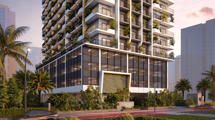 Immeuble moderne de grande hauteur avec une vaste verdure sur les balcons, capturé au crépuscule à Dubaï. Présente un design élégant avec des fenêtres en verre et une façade inférieure distinctive. Entouré de plantes tropicales et d'une voiture qui passe