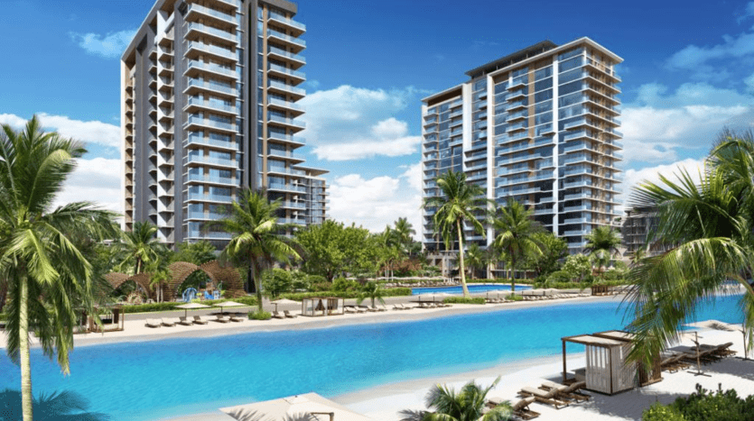 Rendu artistique d'un complexe de luxe en bord de mer avec deux immeubles de grande hauteur entourés de palmiers, une grande piscine et une plage avec des chaises longues sous des parasols, mettant en valeur le premier immobilier de Dubaï.