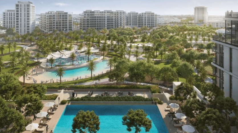 Vue aérienne d'un parc urbain moderne avec une grande piscine, des salons ombragés et un espace de rassemblement animé couvert d'un auvent, entouré d'immeubles d'appartements à plusieurs étages de Dubaï.