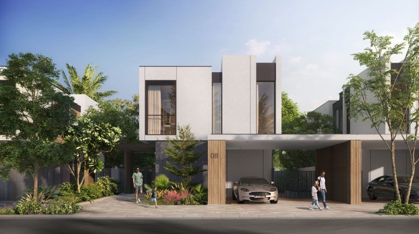 Maison moderne à deux étages au design minimaliste comportant des formes géométriques et de grandes fenêtres. Un homme marche devant tandis qu’une personne passe à vélo. Une voiture de luxe est garée sous une allée couverte. Une verdure luxuriante entoure la maison à Dubaï.