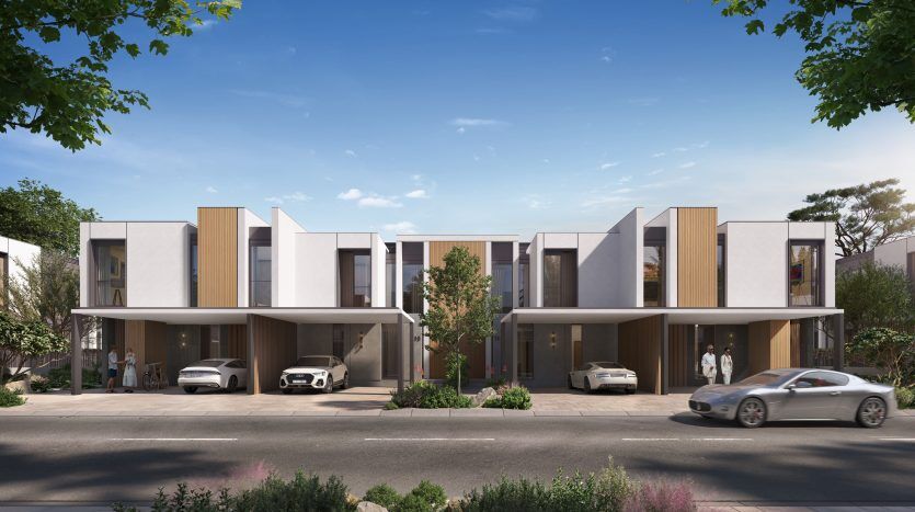 Rendu d'un complexe de maisons de ville moderne à Dubaï avec quatre unités, chacune dotée de grandes fenêtres en verre, d'un toit plat et de places de parking partiellement couvertes. Les arbres et les gens sont également représentés dans une rue calme.