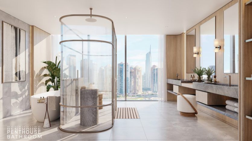 Luxueuse salle de bains penthouse à Dubaï avec une douche cylindrique en verre, une double vasque et de grandes fenêtres offrant une vue panoramique sur les toits de la ville.
