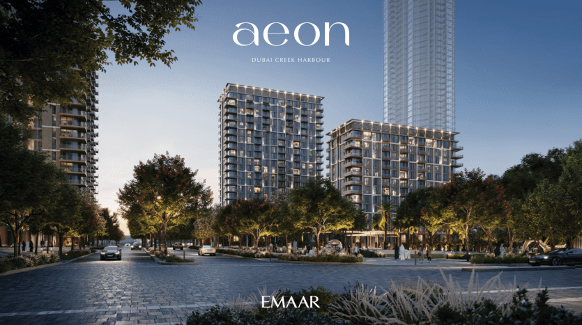 Image promotionnelle de « AEON » au port de Dubaï Creek par Emaar, présentant des immeubles résidentiels modernes et des appartements à Dubaï le long d'un boulevard bordé d'arbres avec des piétons et des voitures au crépuscule.
