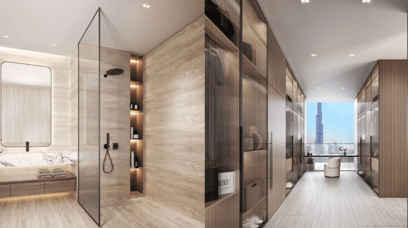 Intérieur de salle de bains moderne et luxueux dans une villa de Dubaï avec une douche en verre, des accents en bois et une vue sur les toits de la ville à travers une grande fenêtre. La pièce dégage une ambiance sereine et bien éclairée.