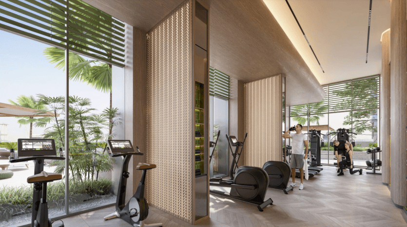 Intérieur de salle de sport moderne doté de tapis roulants et d'appareils de musculation, avec des personnes faisant de l'exercice ; de grandes fenêtres montrent une verdure luxuriante à l'extérieur d'une villa à Dubaï, créant une ambiance lumineuse et aérée.