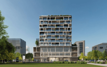 Bâtiment moderne de plusieurs étages doté de vastes fenêtres en verre et d'un espace vert sur le toit, situé dans un parc urbain peuplé de personnes et d'arbres, sous un ciel bleu clair à Dubaï.