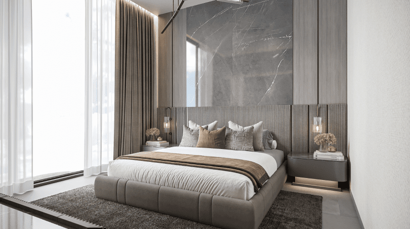 Luxurious modern room in a Dubai villa with a king-size bed flanked by bedside tables and lamps, with wood panelling, soft curtains and a marble wall.