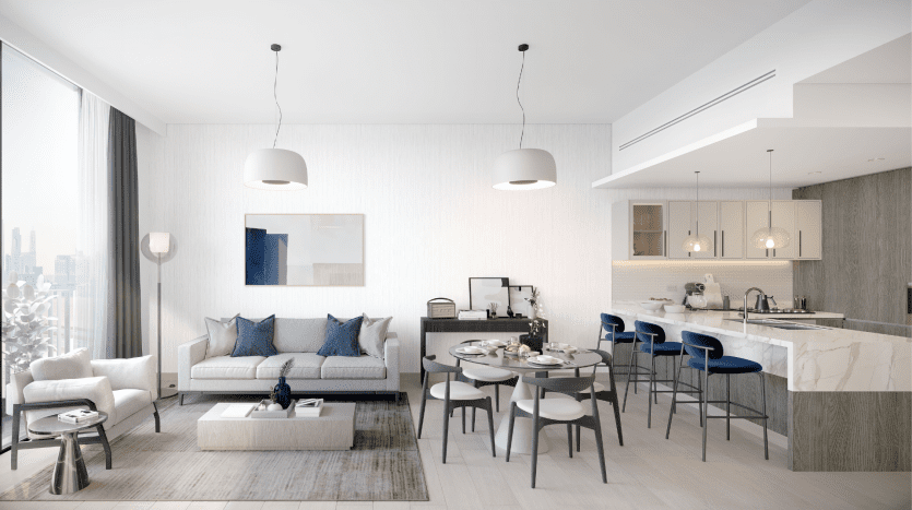 Salon moderne et spacieux relié de manière transparente à une cuisine avec de grandes fenêtres dans une villa de Dubaï, présentant une décoration aux couleurs douces, des meubles élégants et un coin repas aménagé pour un repas.