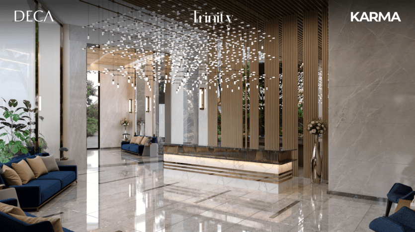 Un hall d'entrée d'hôtel moderne et élégant avec des sols en marbre élégants, un bureau de réception élégant, des lumières décoratives suspendues et un mobilier chic avec des plantes pour une touche de verdure, géré par une agence immobilière de premier plan à Dubaï.
