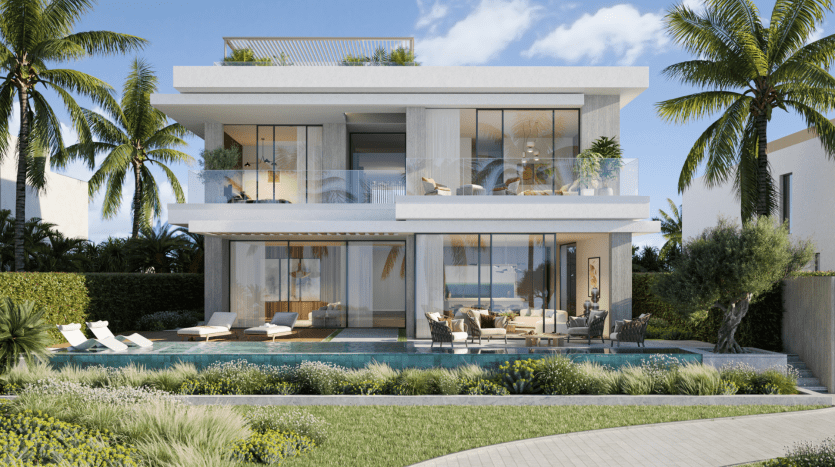 Une villa moderne de deux étages à Dubaï avec de grandes baies vitrées et des balcons, entourée de palmiers et d'un jardin luxuriant. Il dispose d'une piscine en face avec des chaises longues à côté.