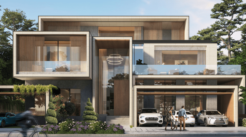 Moderna villa di Dubai con ampie finestre, balcone e giardino anteriore. Una famiglia si trova accanto a due auto parcheggiate nel vialetto e un ciclista passa in strada.