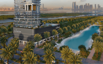Vue aérienne d'un bâtiment moderne au bord d'une rivière sinueuse avec des palmiers, surplombant les toits de la ville de Dubaï au coucher du soleil.