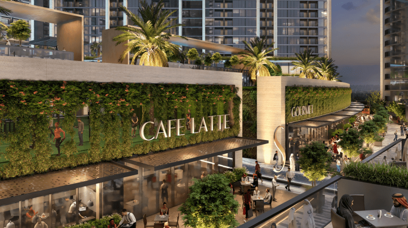Un rendu artistique d'une scène de rue urbaine animée à Dubaï au crépuscule, avec des bâtiments modernes avec une végétation luxuriante et des arbres, et des cafés animés comme le « Café Latte ». Les gens se promènent et profitent de la soirée.