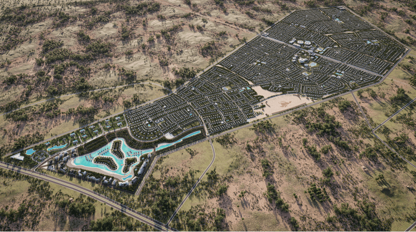Vue aérienne d'un grand projet de développement urbain comportant des zones résidentielles denses dotées d'un réseau routier. Le plan, commercialisé par une agence immobilière de Dubaï, comprend un complexe de grande taille avec plusieurs piscines, espaces verts et jeux d'eau d'un côté. Autour du développement se trouvent des paysages naturels.