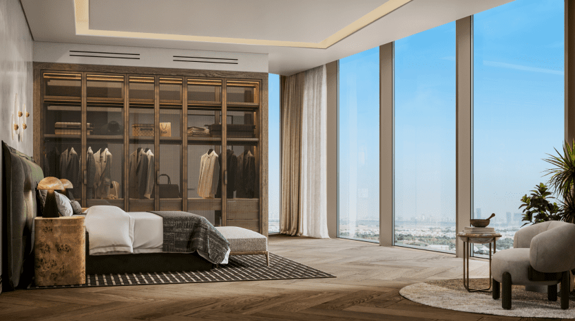 Une chambre luxueuse dans une villa de Dubaï avec une grande armoire en verre présentant des vêtements, un lit vert moelleux et des baies vitrées donnant sur un paysage urbain. La chambre présente une décoration moderne avec une ambiance chaleureuse et sophistiquée.