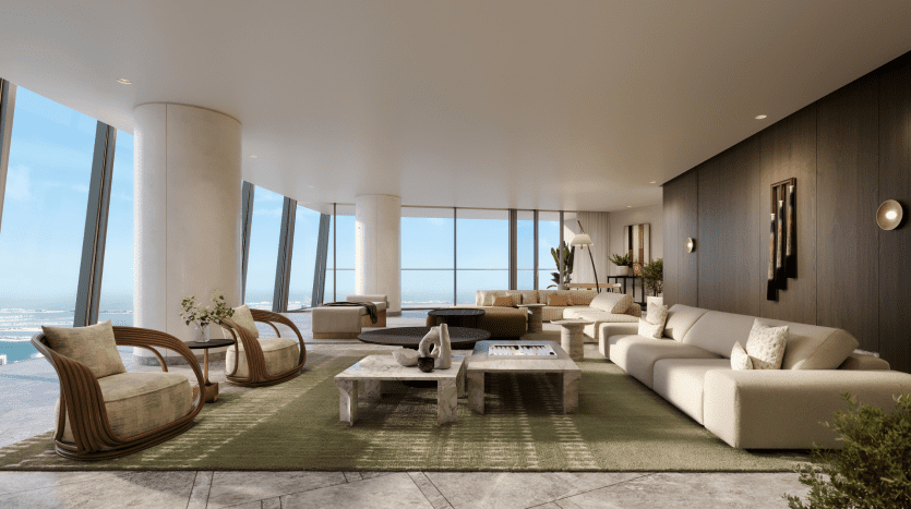 Luxueuse villa moderne à Dubaï offrant une vue imprenable sur l'océan, comprenant des canapés beiges courbés, d'élégantes chaises en bois et une élégante table basse centrale sur un grand tapis vert.