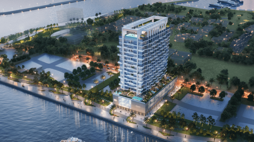 Vue aérienne d'Azura Residences, un immeuble moderne de grande hauteur situé à proximité d'un front de mer. Les appartements de luxe, entourés d'espaces verts et d'allées, disposent d'une piscine sur le toit. À côté se trouvent des arbres, des pelouses et des bâtiments supplémentaires. La scène est éclairée par une douce lumière ambiante du soir.
