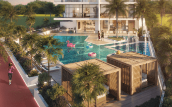 Espace piscine luxueux de style complexe entouré d'une verdure luxuriante, comprenant une grande piscine avec des flamants roses gonflables et une passerelle centrale. les gens profitent tranquillement de l’ambiance ensoleillée.
