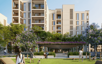 Immeubles d'appartements modernes avec balcons entourés de verdure luxuriante et d'arbres à fleurs violettes. des gens marchant et se reposant dans un parc communal animé avec des bancs et un sentier.