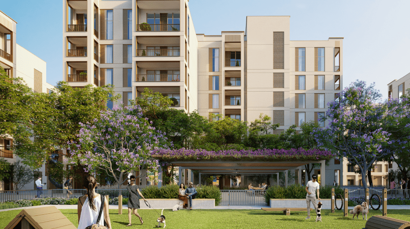 Immeubles d'appartements modernes avec balcons entourés de verdure luxuriante et d'arbres à fleurs violettes. des gens marchant et se reposant dans un parc communal animé avec des bancs et un sentier.