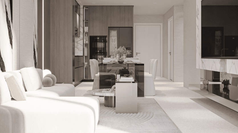 Salon moderne des résidences Primero Al Furjan avec des tons neutres comprenant un canapé blanc, une table basse élégante et un tapis à motifs. Au fond, une table à manger en verre avec des chaises et des étagères intégrées. La lumière pénètre par une grande fenêtre, créant une atmosphère lumineuse et aérée.