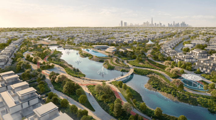 Vue aérienne de Dubaï Sud, une ville moderne avec un grand parc luxuriant au centre, doté de sentiers sinueux, d'espaces verts, d'étangs et de ponts. Autour du parc se trouvent de nombreux bâtiments résidentiels d'Emaar. L'horizon de la ville, parsemé de grands gratte-ciel, constitue la toile de fond de cette nouvelle communauté.
