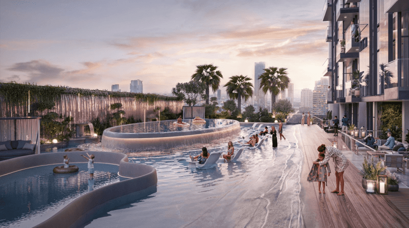 Un espace piscine sur le toit au coucher du soleil avec des gens se relaxant sur des transats et dans l'eau. Les palmiers et les bâtiments modernes sont en arrière-plan. La série Autograph S confère un design chic et luxueux aux multiples sections de la piscine et à l'aménagement paysager élégant.