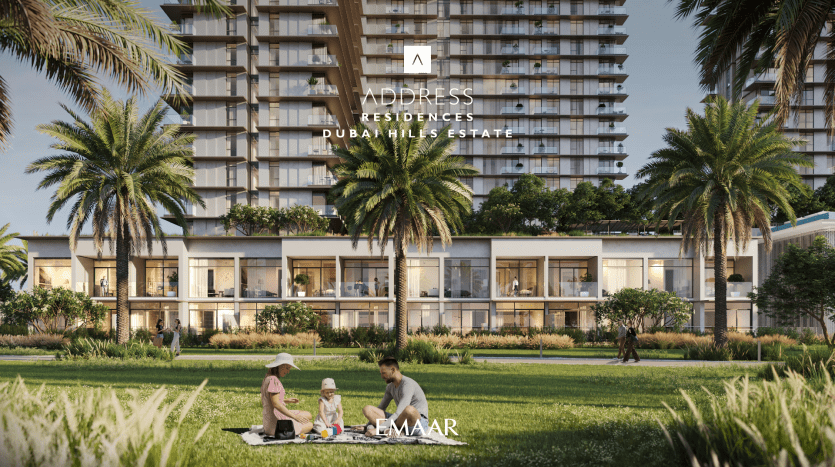 A modern residential building with lush vegetation and palm trees in front. A family of two adults and a child picnic on the lawn. The text "Address Residences Dubai Hills" is displayed at the top.