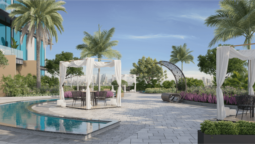La luxueuse terrasse extérieure du Skyhills 2 comprend des cabanes modernes drapées de rideaux blancs, situées à côté d'une piscine réfléchissante tranquille. Entouré de palmiers luxuriants et de verdure, l'espace surplombe un paysage urbain sous un ciel bleu clair, créant une ambiance tropicale sereine.